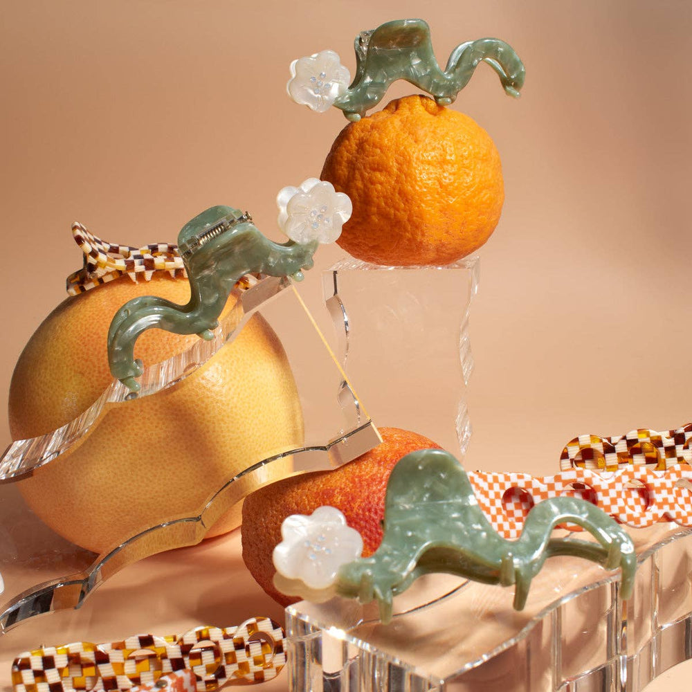 
                  
                    Load image into Gallery viewer, White Orange Blossom Flower Small Squiggle Acetate Hair Claw
                  
                