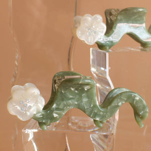 
                  
                    Load image into Gallery viewer, White Orange Blossom Flower Small Squiggle Acetate Hair Claw
                  
                