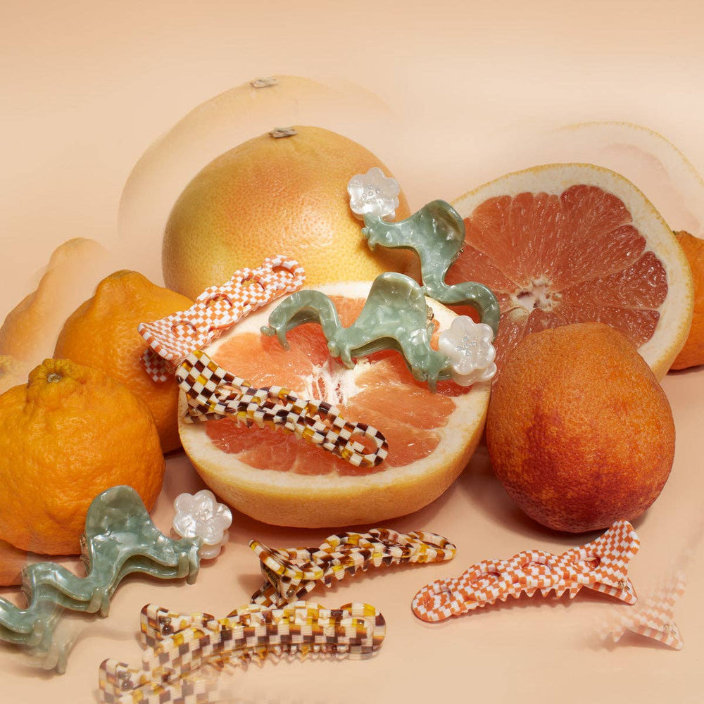 
                  
                    Load image into Gallery viewer, White Orange Blossom Flower Small Squiggle Acetate Hair Claw
                  
                